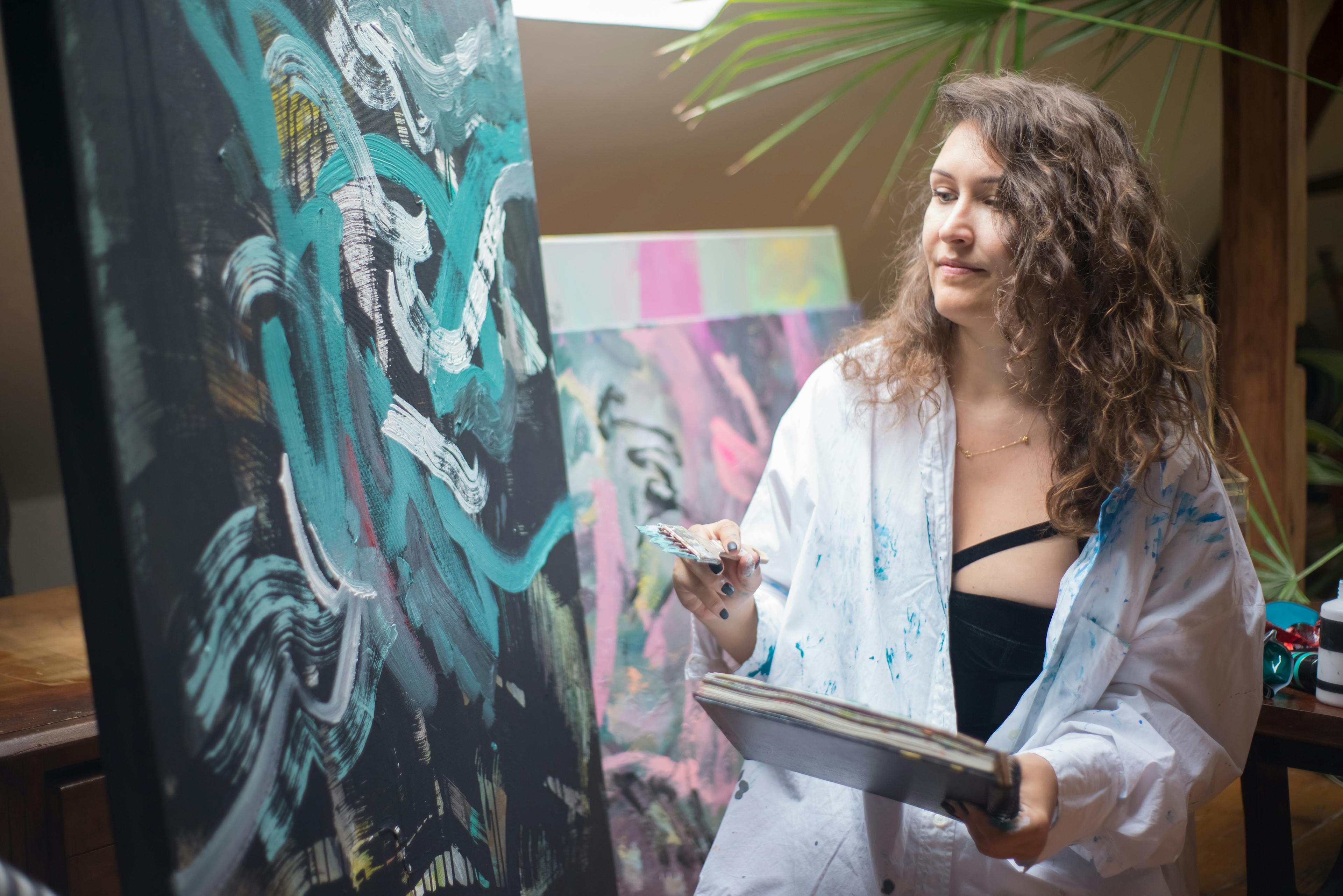 Artist painting in studio